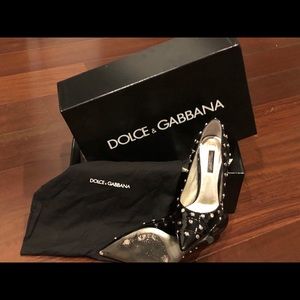 Dolce Gabbana patent heels with grommets.